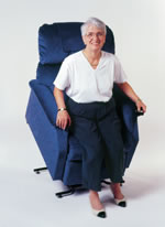 Lady in white shirt standing up from lift chair.